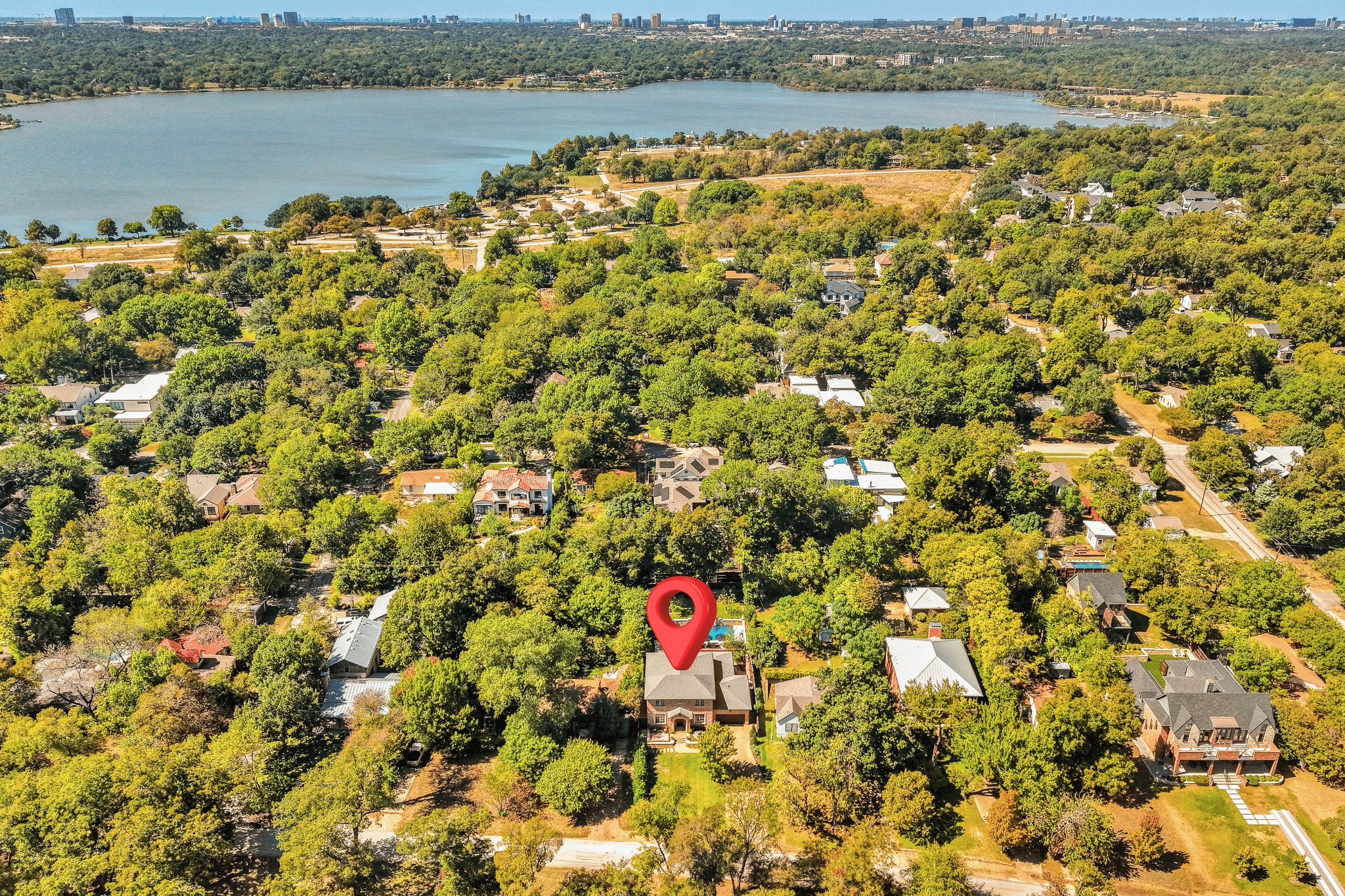 Park-facing exterior of 9319 East Lake Highlands in the Peninsula neighborhood, facing White Rock Lake Park, Dallas